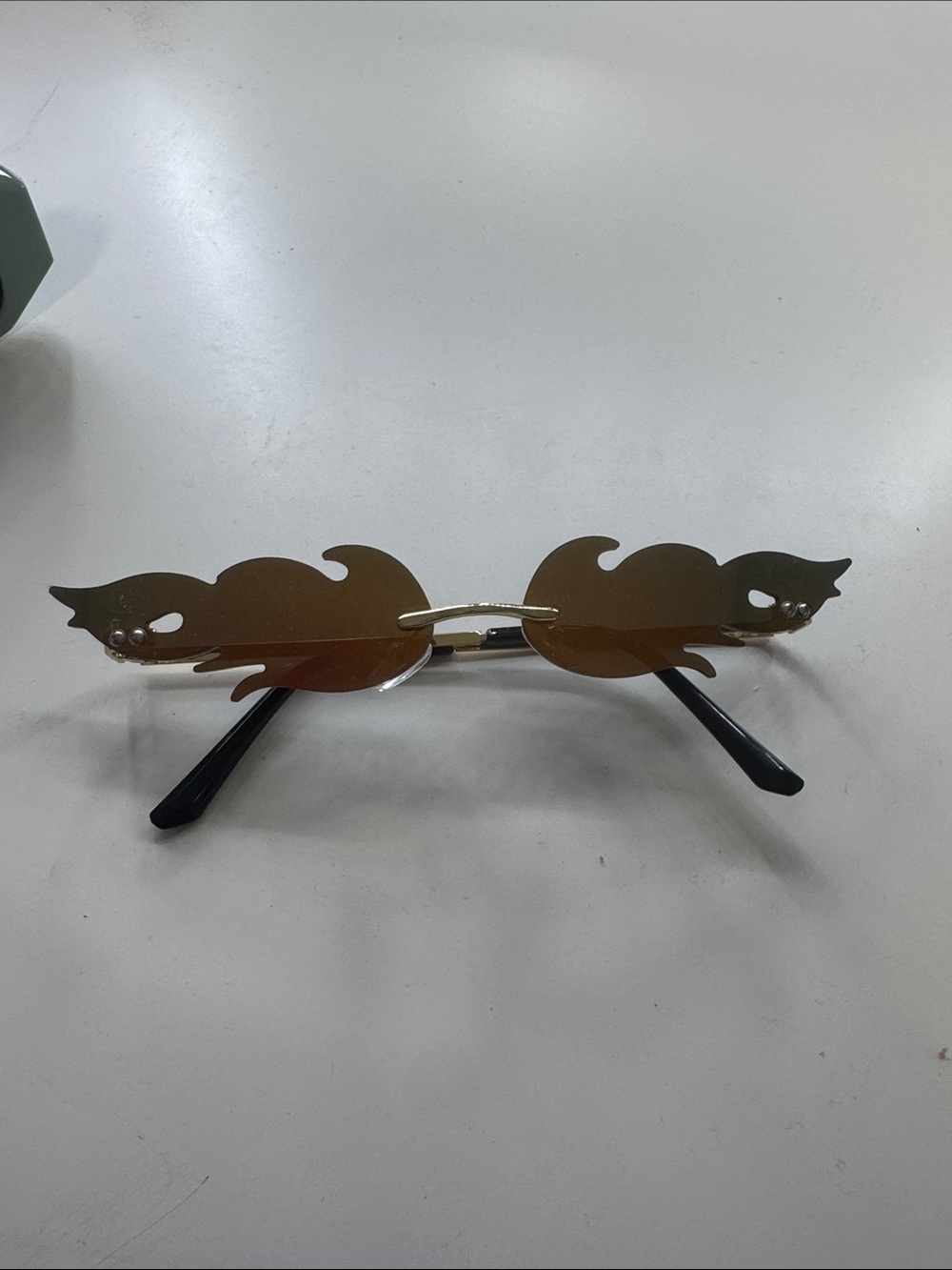 Flame-Edge Rimless Sunglasses in Black and Gold